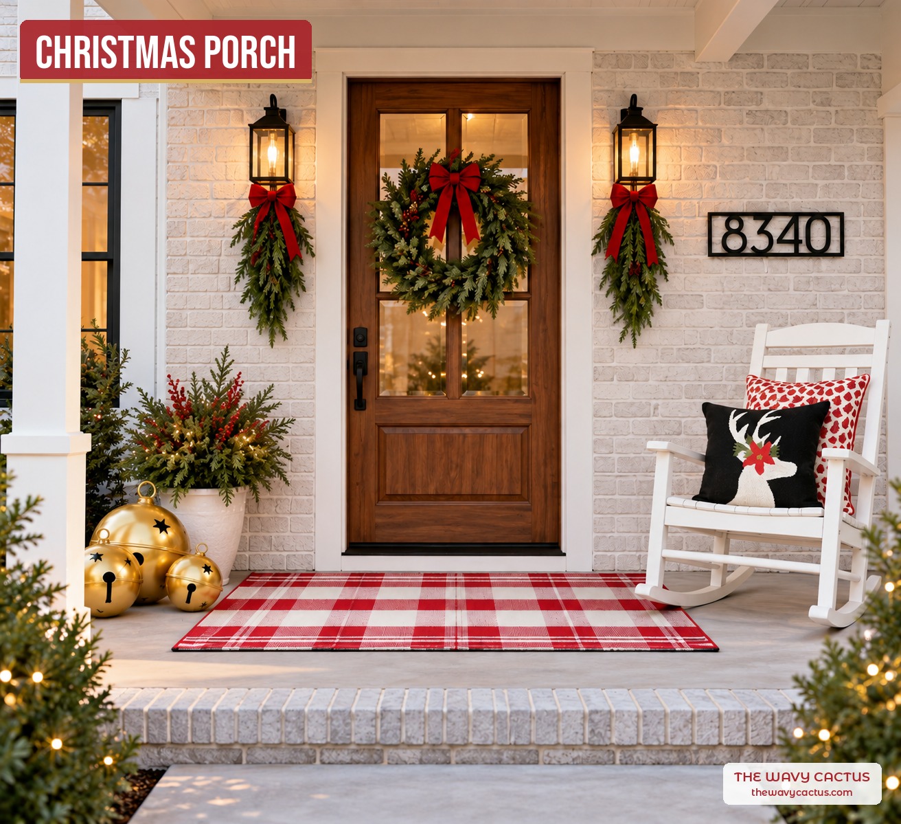 Christmas front porch with an evergreen berry wreath, evergreen swags with red bows, a red buffalo check rug, a white rocking chair with holiday pillows, a porch planter with gold jingle bells, and a custom metal house number sign